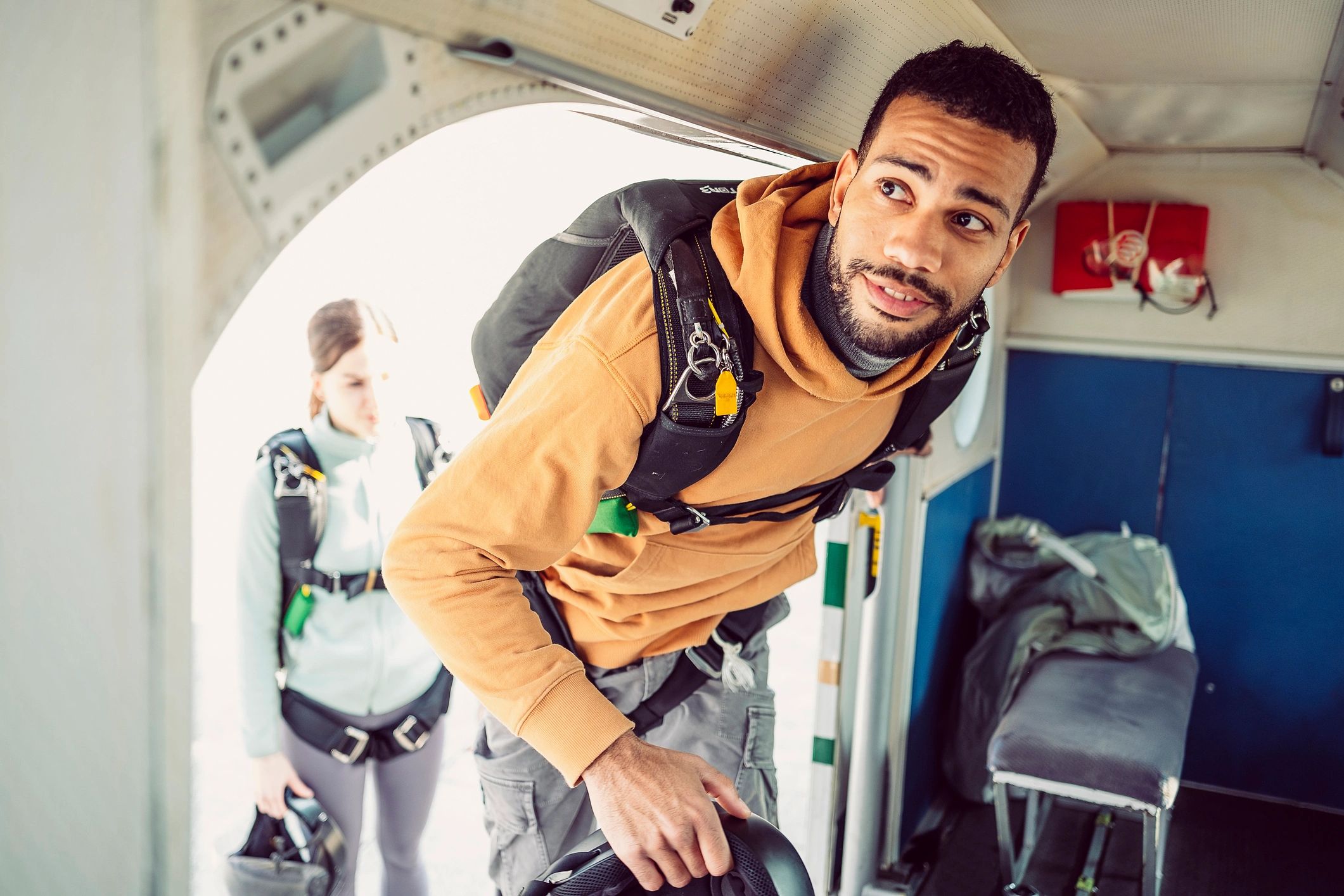 Pilot emergency parachute rig in aviation setting